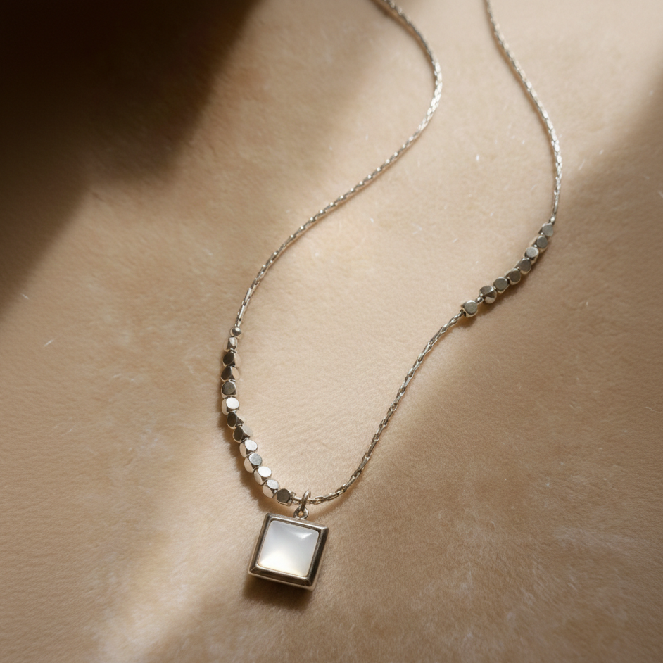 Sterling silver necklace with green/white square pendant