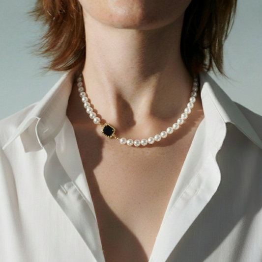 Elegant pearl choker with black pendant