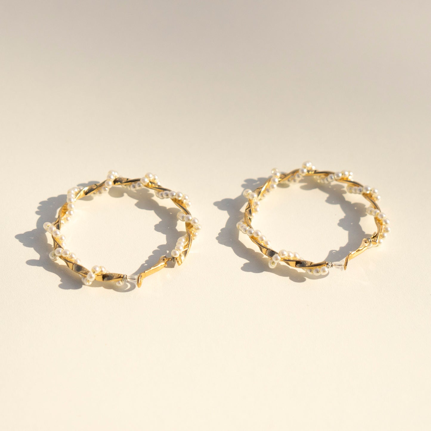 Twisted hoop earrings/earclips with delicate pearls