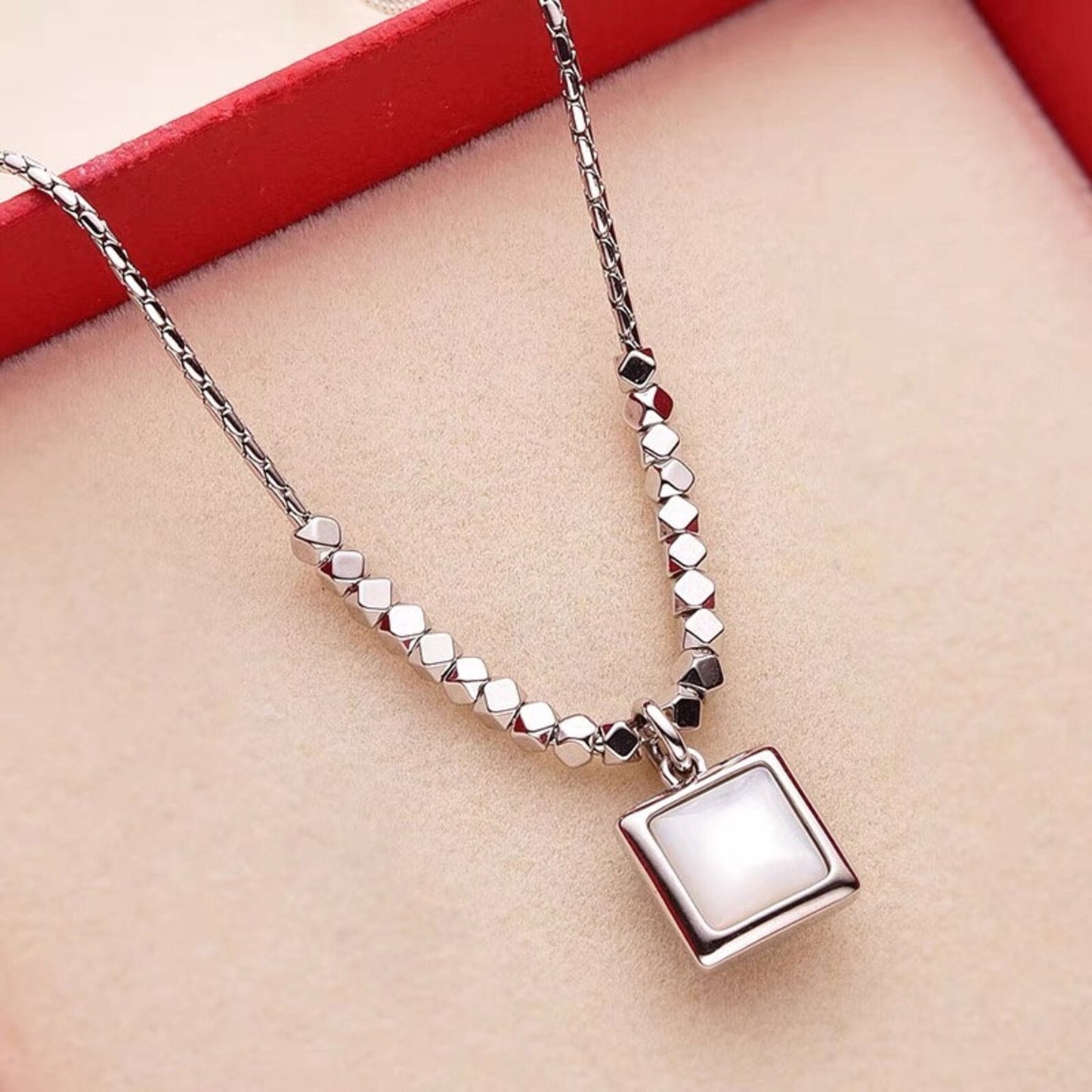 Sterling silver necklace with green/white square pendant